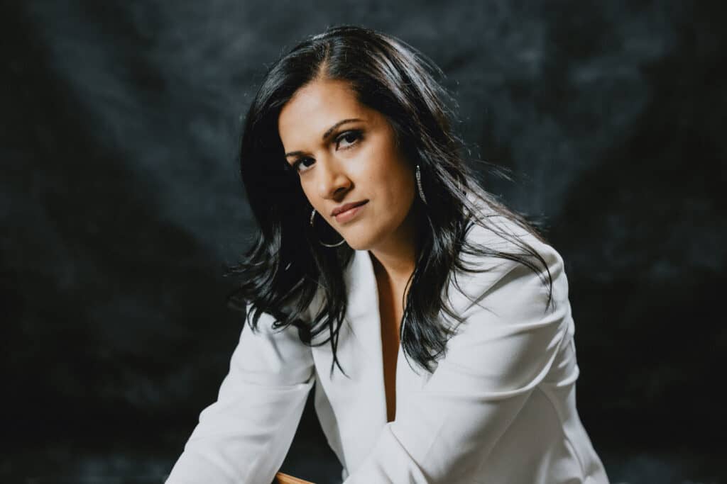 Dramatic Headshots image of a woman wearing a white blouse