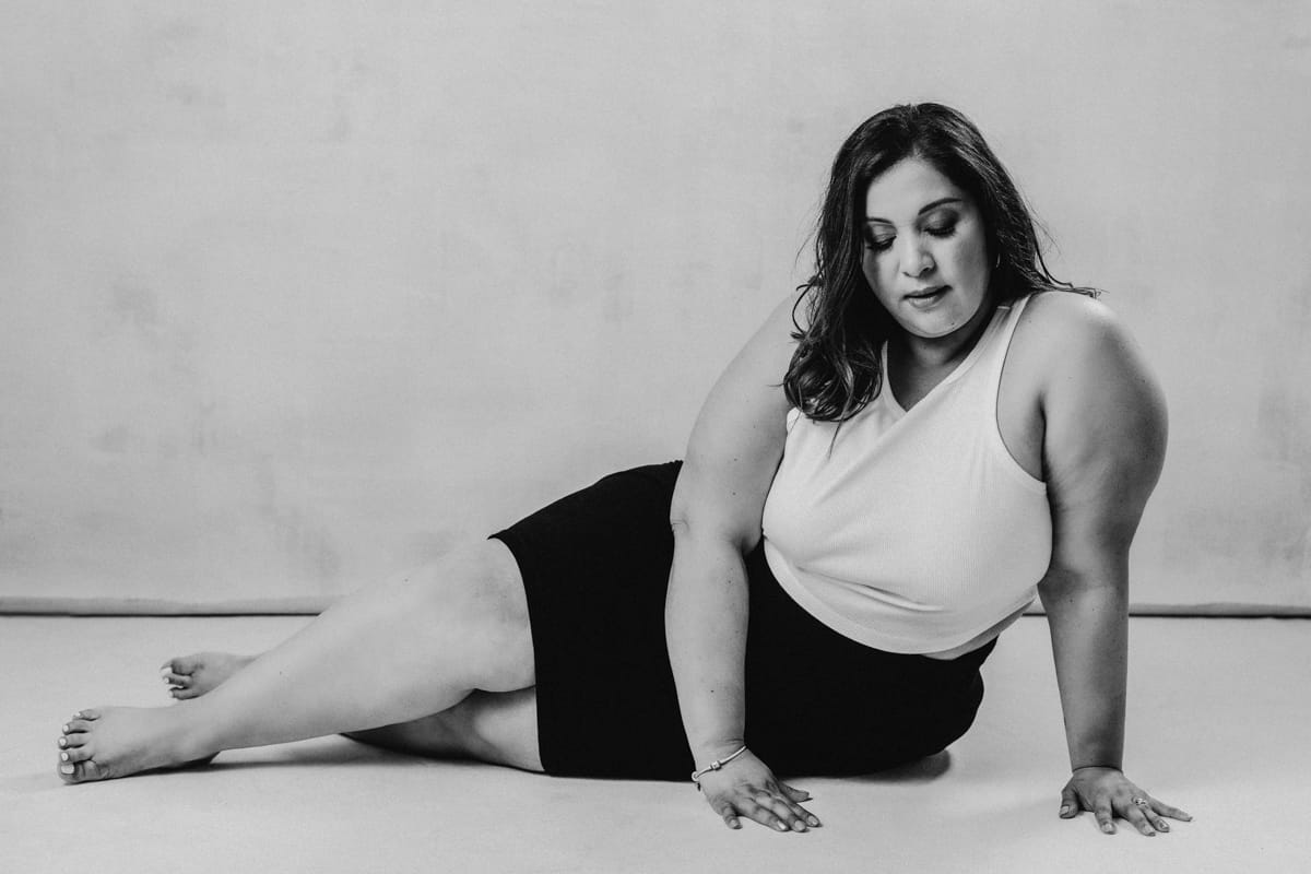 Vancouver boudoir black and white portrait of women laying down on side
