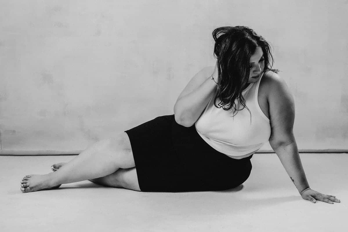 Vancouver boudoir black and white portrait of plus size women laying on side