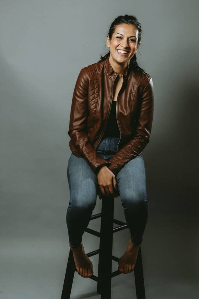 image of a woman sitting on a stool