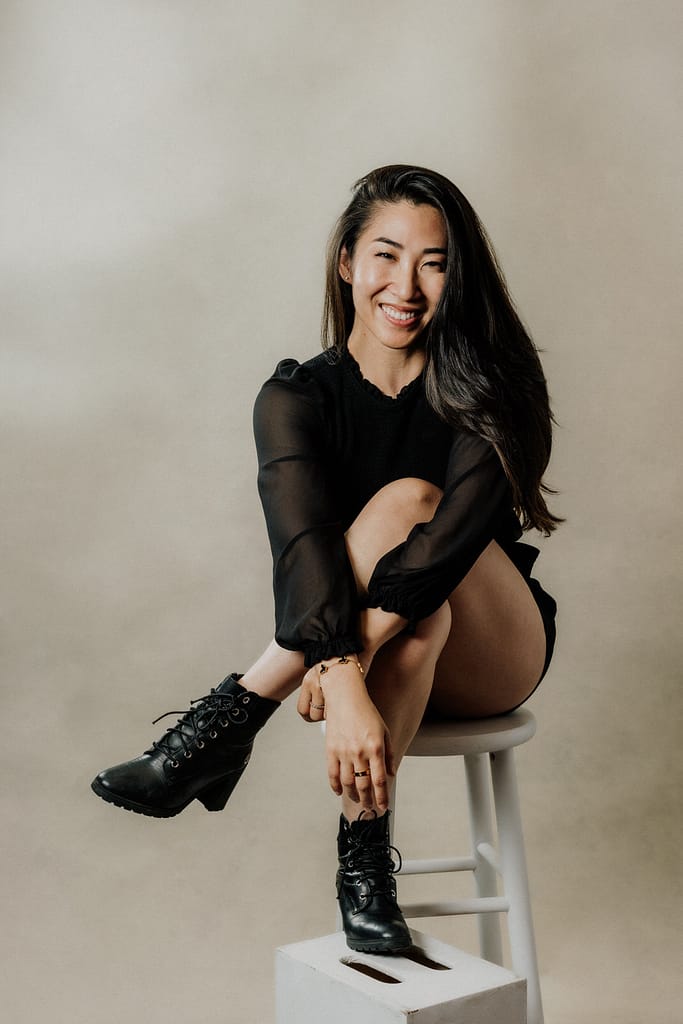 Vancouver Portrait Photographer Michele Mateus creates contemporary portraits and headshots of Vancouver professionals. Pictured here is a portrait of an Asian woman looking relaxed and stylish.