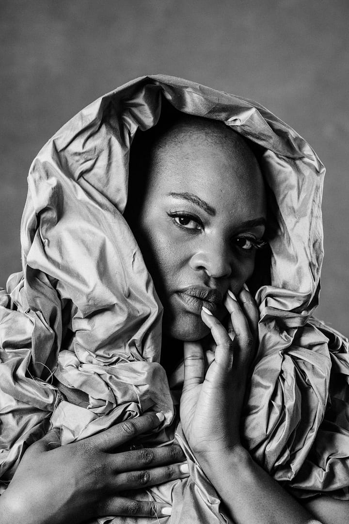 vancouver boudoir photographer image of plus size black woman with alopecia draped in fabric around head