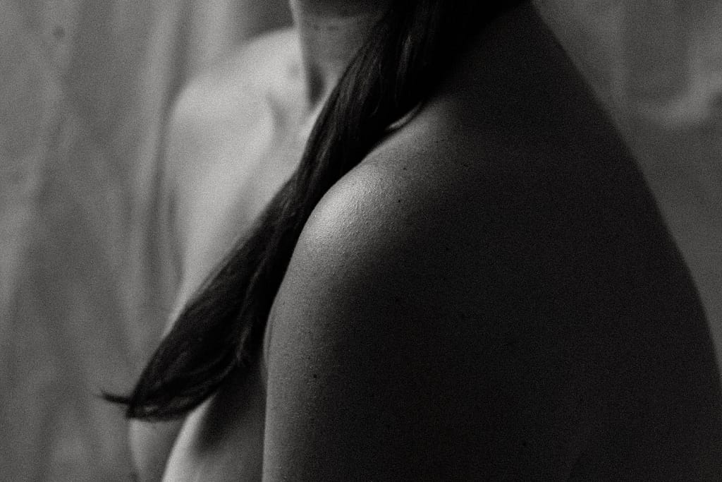 vancouver boudoir black and white image of naked woman's shoulders and chest