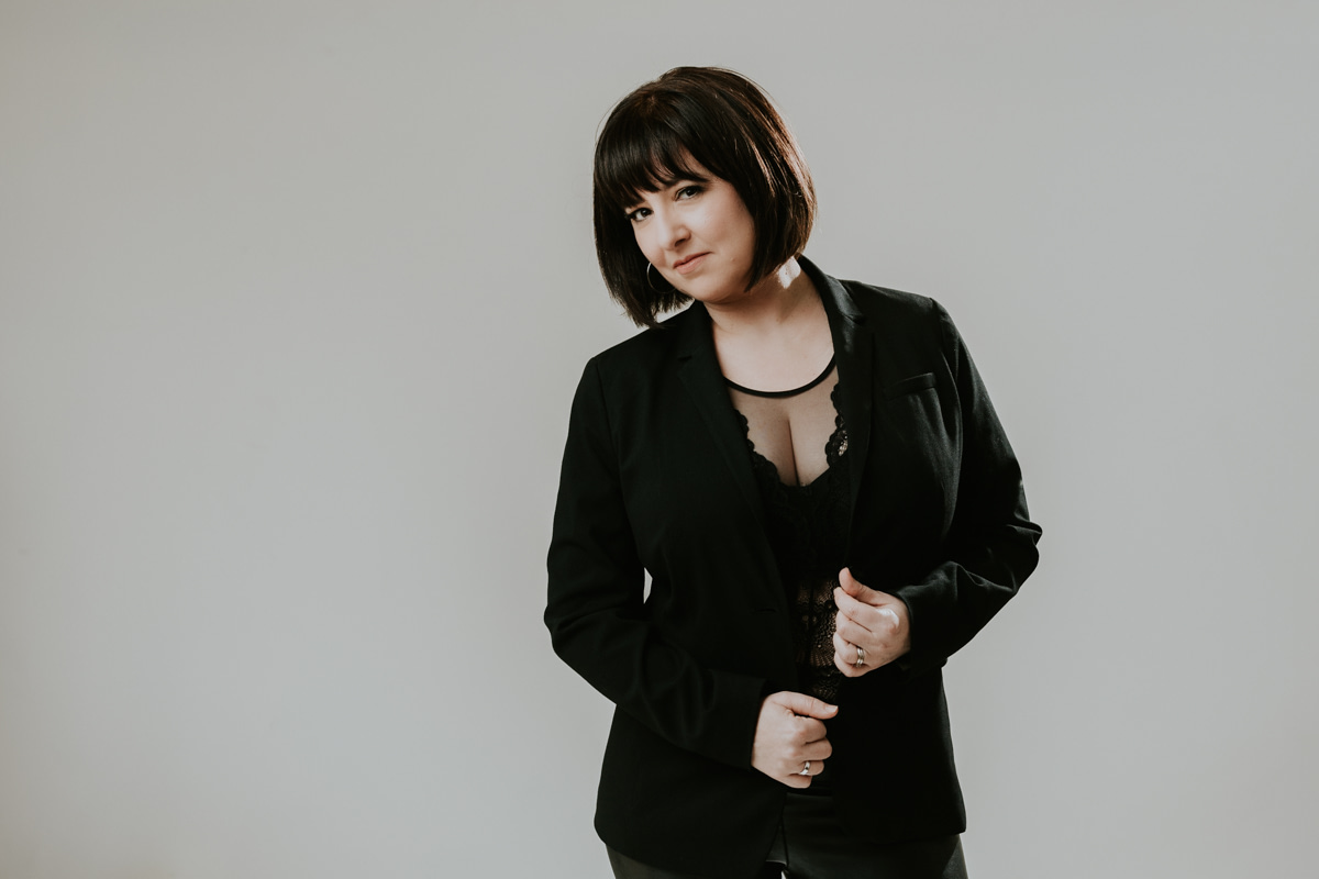 Professional portrait of woman with short hair and bangs. Professional headshot studio Vancouver.