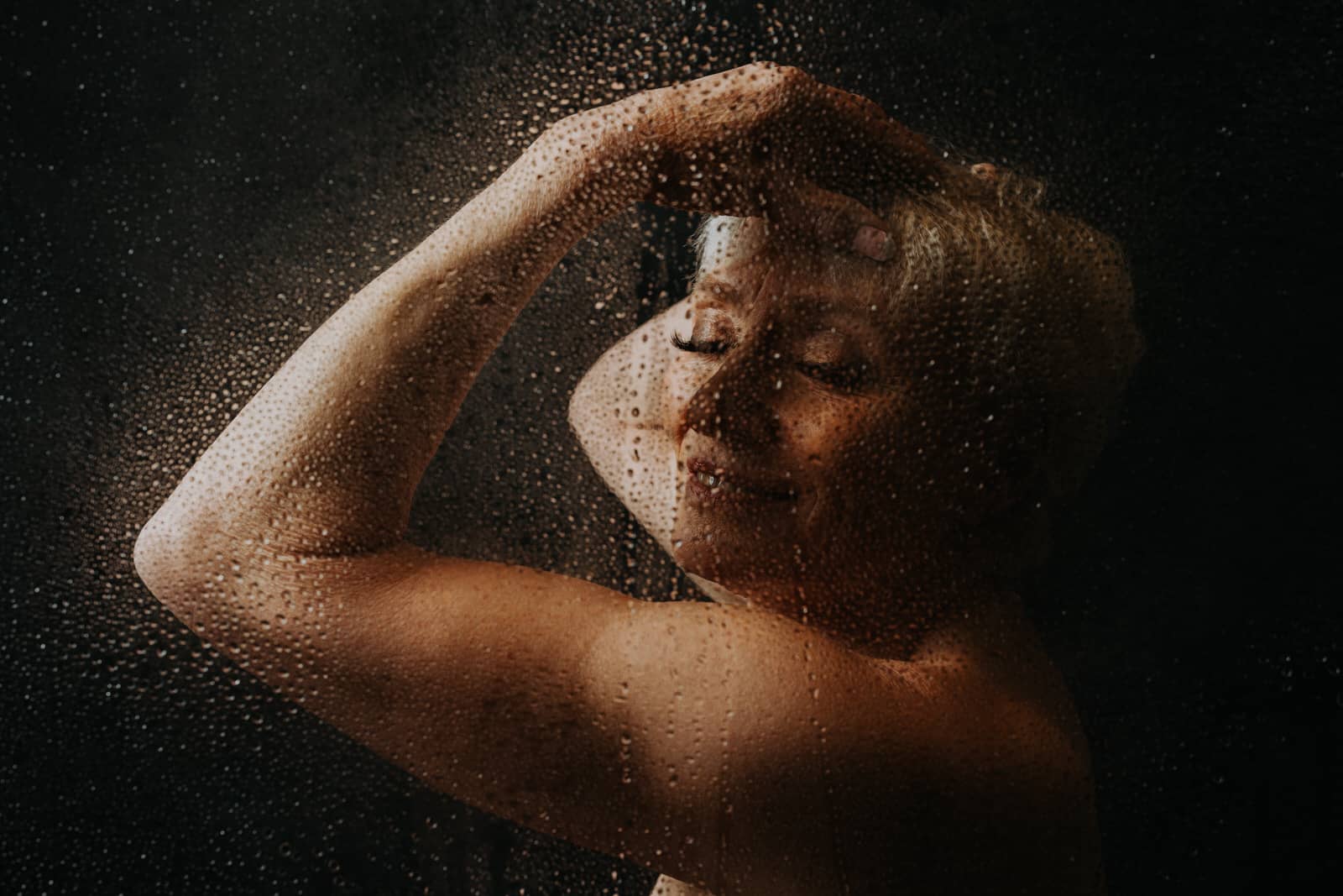 boudoir portrait of a woman with water drops. Boudoir photographer coquitlam