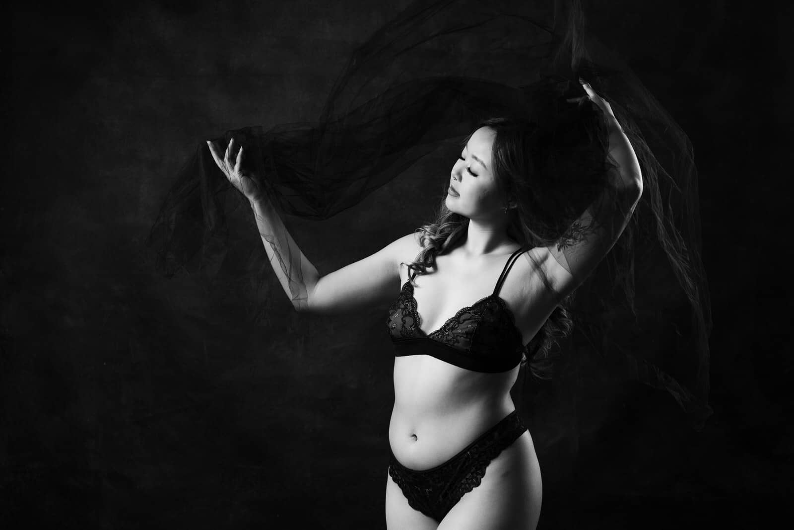 Black and white Vancouver boudoir photoshoot portrait of woman in lingerie, Vancouver Mateus Studios Studio