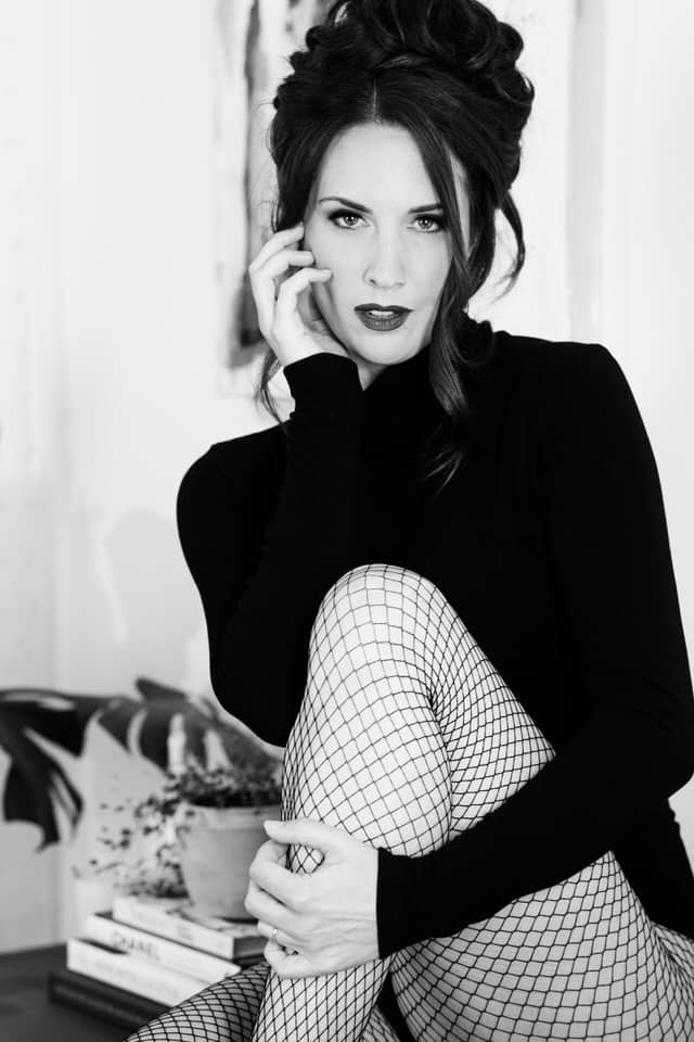 Woman in Fishnet Stockings for Boudoir Photography in B&W