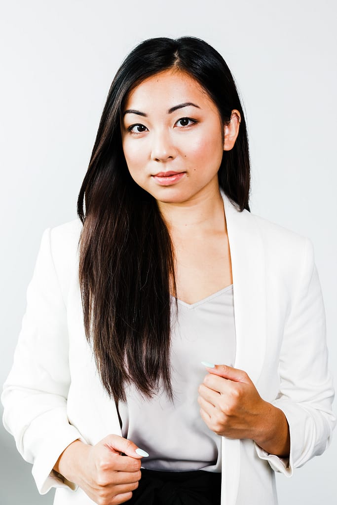 Professional headshot of an asian women looking into the camera. Vancouver headshot photographer.