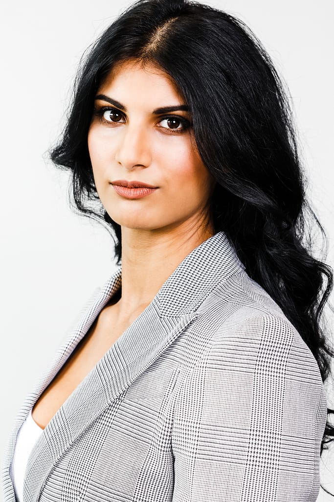 Headshot of a women with long black hair. Professional headshots Vancouver.