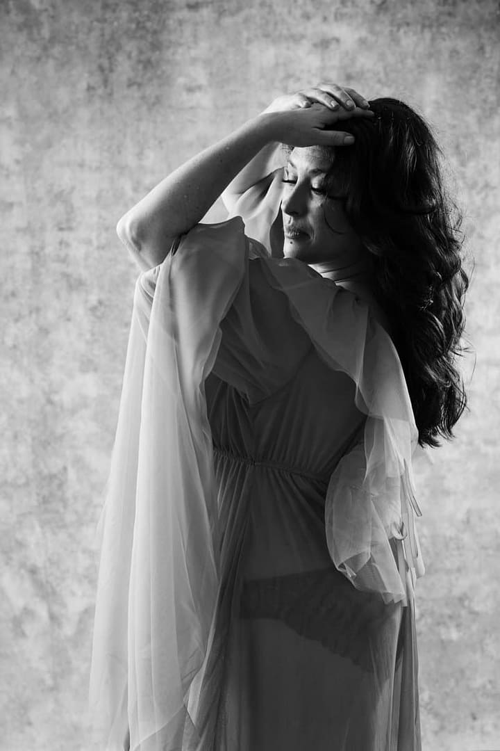 boudoir image of curvy woman draped in tulle